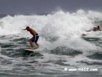 Surfers enjoying the Big waves from Hurricane Alex at Panama City Beach July 1, 2010