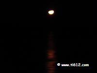 Moon setting in the Gulf at Tina's Treasure Island - Panama City Beach, Florida 1/14/2011